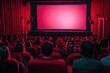 © Vooglo.com - A cinema hall filled with red seats, where an audience is watching a movie. The focus is on the large