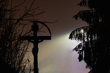 Wall Mural - Halloween concept with cross on a foggy night in the graveyard.