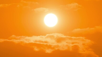 Wall Mural - time lapse of dramatic sunrise with orange sky in a cloudy day.