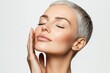 © Vooglo - Gorgeous senior older woman with closed eyes touching her perfect skin