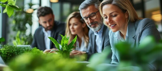 Wall Mural - Business Team Collaborating in Modern Office with Green Plants and Natural Light