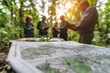 © ImagePulse - A forest conservation strategy being discussed by a group of ecologists, with maps and data showing reforestation efforts