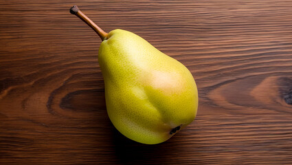 Wall Mural - Ripe sweet pear isolated on wooden background, Juicy fresh pear on a wooden table, Fresh pear on a wooden background with copy space