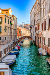 Wall Mural - A stunning and beautiful view of a picturesque Venice canal, showcasing vibrant architecture and tranquil waters