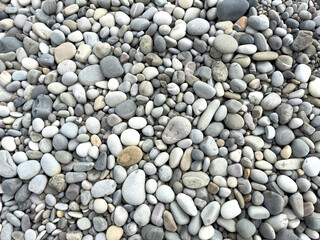 Wall Mural - Stone pebbles as an abstract background. Texture