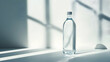 © Komkrit - A clear bottle of alkaline water resting on a crisp white surface, with soft sunlight streaming in from the side. The label is designed in a modern scientific font, creating a sense of purity and