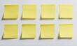 © Dmitriy - Eight yellow sticky notes attached to a white wall