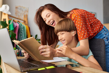 Wall Mural - A mother and her son bond over a book, celebrating their connection and love.