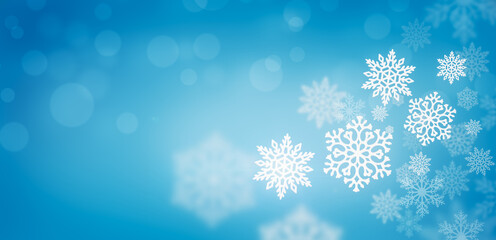 Wall Mural - Winter snowfall on a blue background. Cold winter.