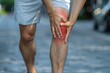 © Anna - Man in Sportswear Holding Injured Knee in Pain During Outdoor Activity.