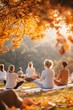 © Premium_art - Group of yoga class in a park with autumn leaves, serene and tranquil atmosphere.