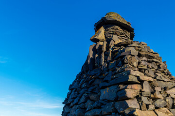 Bardur Snaefellsas statue. A large stone structure with the face of a man