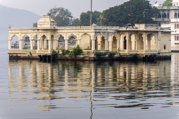 artistic palace architecture at pristine lake at morning