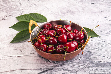 Wall Mural - Red sweet cherry in the bowl