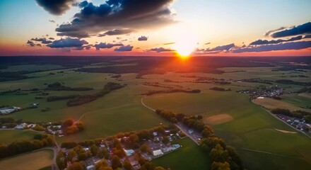 Wall Mural - Slow motion of a beautiful summer sunset filmed from a high point great perspective video 4k animation