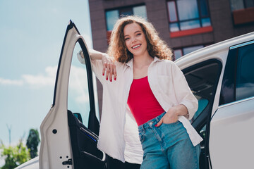 Poster - Photo of cheerful lovely lady dressed white shirt smiling driving automobile enjoy traffic outdoors urban city street