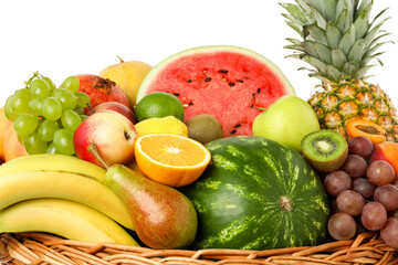 Canvas Print - Many different fresh fruits in wicker basket isolated on white