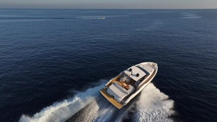 Wall Mural - Aerial view of a yacht sailing at full speed