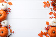 © azurita - A white background with a row of pumpkins and leaves