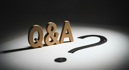 Poster - Wooden letters Q&A on a table with handwritten question mark for educational context