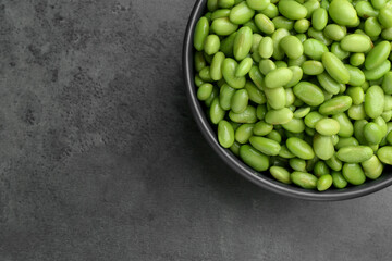 Canvas Print - Raw green edamame soybeans on grey table, top view. Space for text