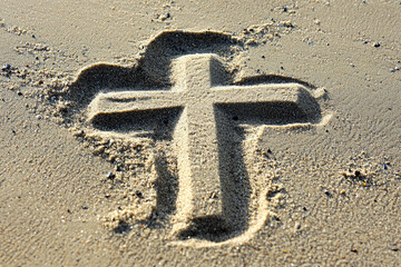 A Simple Symbol Etched in Sand: Faith on the Beach