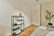 © ADDICTIVE STOCK - Cozy bedroom interior with stylish metal shelving