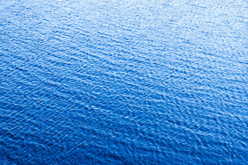 Blue sea water surface with abstract ripple pattern