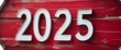 © Anna - number 2025 written on red wooden signboard