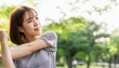 © ochikosan - 公園でストレッチをしている若いアジア人の女性。（Young Asian woman stretching in the park.）