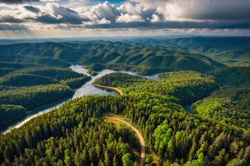 Lush green mountains and valleys under a dramatic cloudy sky