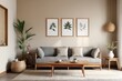 © PNG&Background Image - Japandi-style living room with a sofa, table, and mockup frame on the wall with copy space.