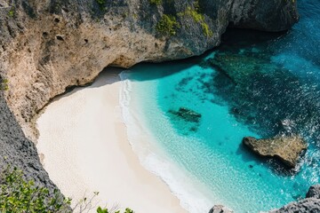 Wall Mural - an aerial view of a beach with a rock formation