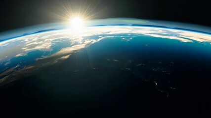 Wall Mural - a stunning aerial view of earth from space shows its curvature, illuminated by the rising sun. wispy