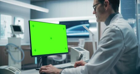 Aufkleber - A Male Scientist in a White Lab Coat Works on a Green Screen Computer in a Advanced Medical Lab, Focusing on Advanced Healthcare Research and Analysis in a High-tech Hospital Environment.