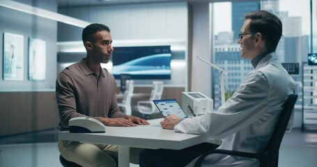 Poster - Male Doctor Consults With a Male Patient in a High-tech Medical Lab, Discussing Health Data on a Tablet. the Modern Hospital Setting Emphasizes Advanced Healthcare and Precise Analysis.