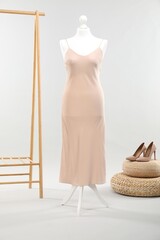 Poster - Mannequin with new stylish dress and high heels on light grey background