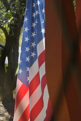 american flag on the front porch of a house