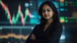 © Papisut - Indian businesswoman standing confidently with stock market graphs in the background modern portrait financial analysis