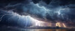 © triocean - A stormy sky with multiple cloud to ground lightning strikes,  flashes of lightning and the rumble of thunder, showcasing the power of a storm.