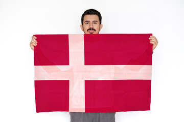 Young man holding Denmark flag, protest or social issues in Denmark, two hands and white 