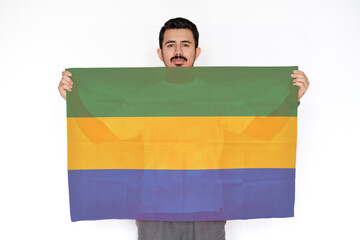 young man holding gabon flag, two hands and white background, celebration or campaigning concept