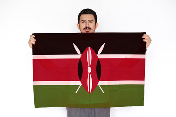 Young man holding Kenya flag, celebration or campaigning concept, two hands and white background