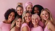 © Dara - Diverse group of women embracing in pink for breast cancer awareness
