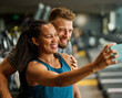 © Lumos sp - gym sport fitness exercise health woman training phone selfie coach trainer instructor personal photo portrait self posing camera healthy boyfriend girlfriend love