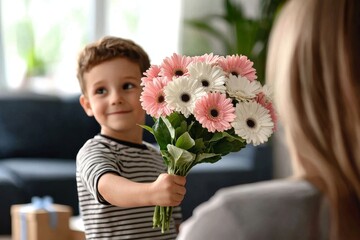 Blond boy giving floral bouquet and box with gift to mother on Mother's Day