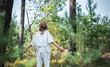 © Olena Rudo - A teenage girl who breathes fresh air and relieves stress in the forest.