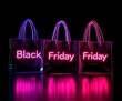 © Pastel King - Neon words 'Black Friday', neon shopping bags on black background