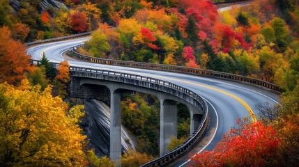 Canvas Print - The Blue-Roofed Bridge Over the Blue Ridge Mountains, and a winding road along it with fall foliage. 