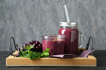 Poster - Tasty fresh acai juice with mint and berries on grey table